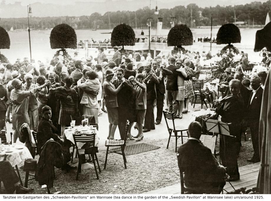 Photograph of people dancing and drinking tea at "Swedish Pavilion" on Lake Wannsee